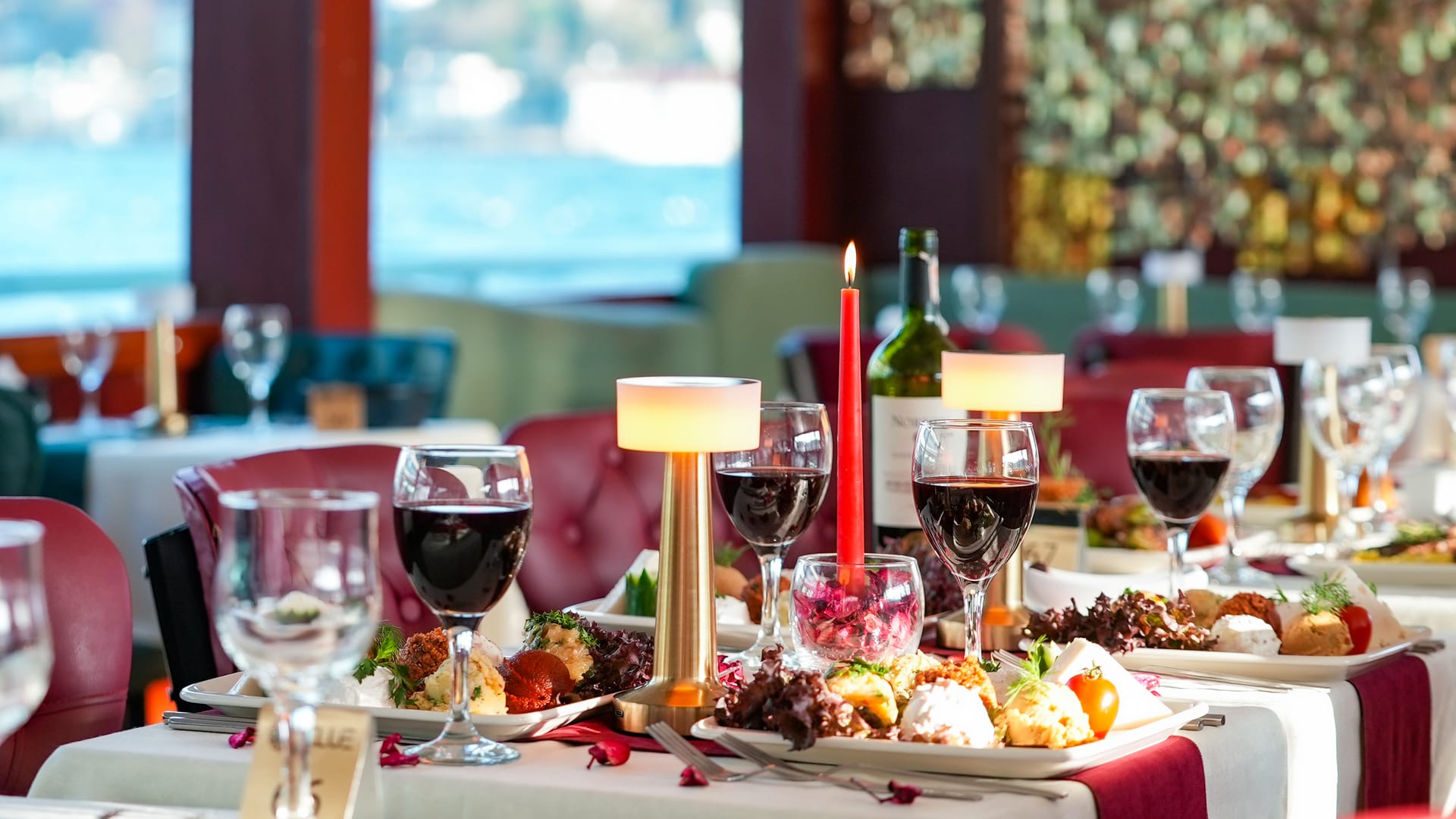Romantic candlelit dinner table setting on the Bosphorus night cruise