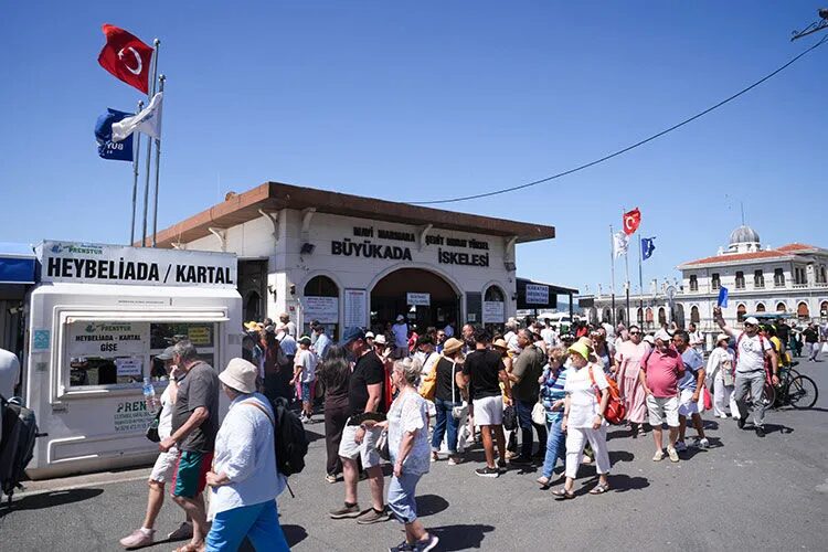 Büyükada ferry pier crowded with visitors arriving on the Princes' Islands